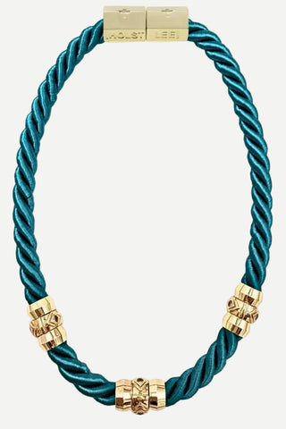 A teal rope bracelet with gold-tone hardware, including a lobster clasp engraved with 'ROLEX LEE' and three decorative gold beads, shown on a white background.